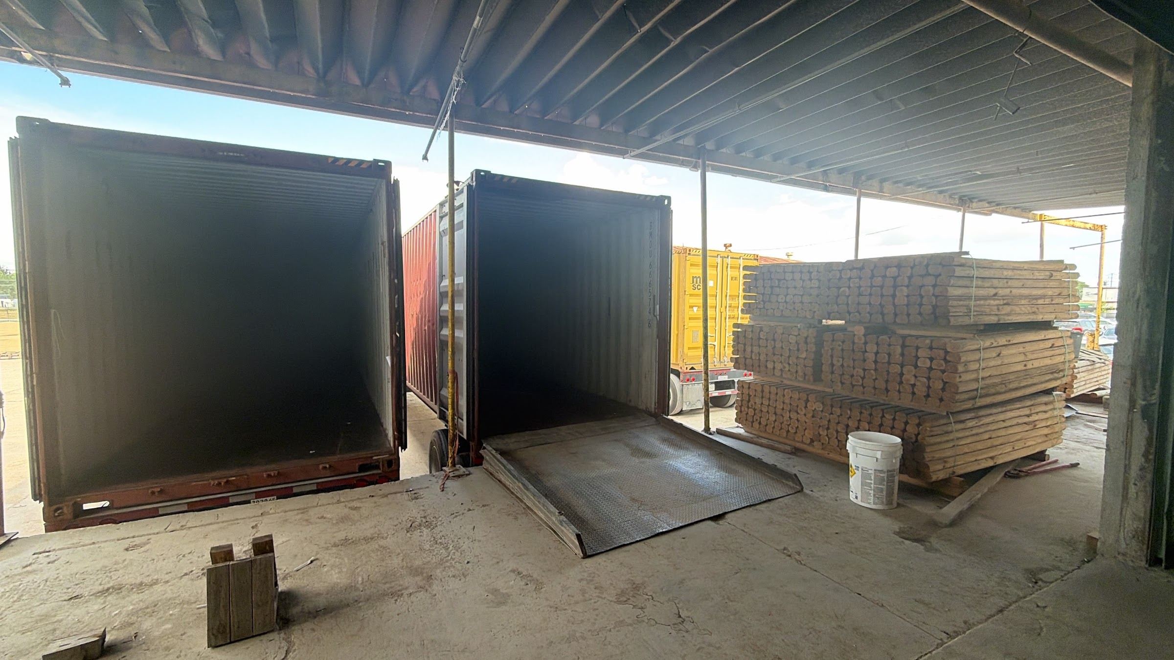 Two open shipping containers being loaded at the Aeneas Exporting Houston facility